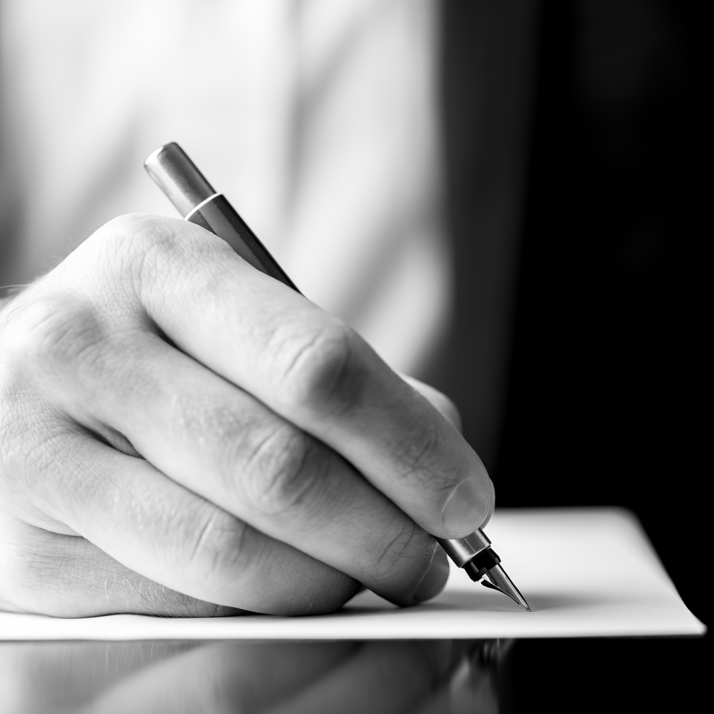 Low,Angle,Black,And,White,Image,Of,A,Male,Hand