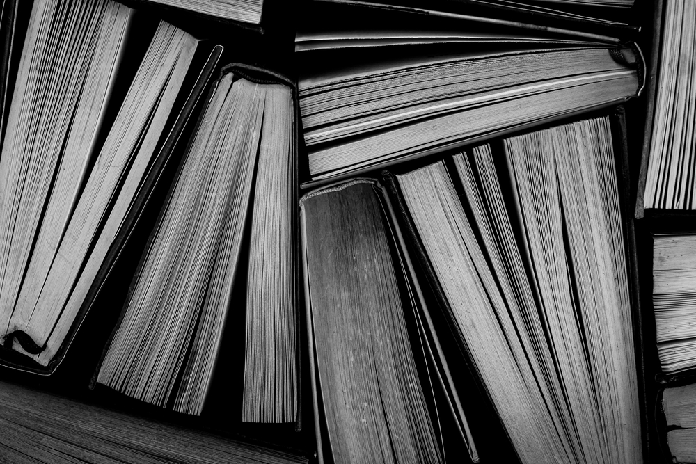 Old,Books,Side,By,Side.,Texture.,Copy,Space.,Black,And